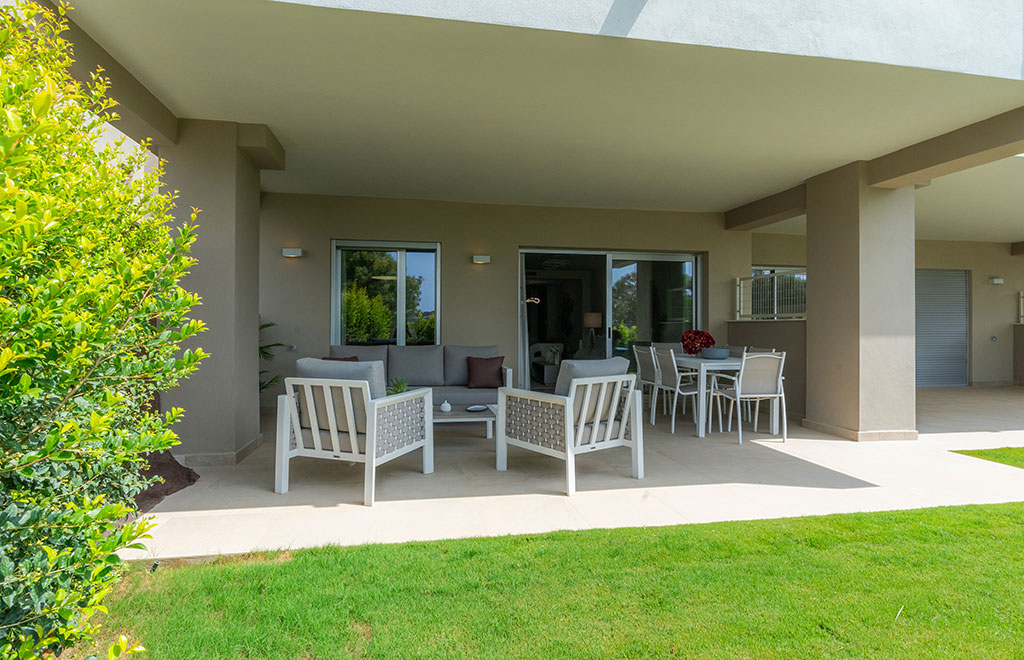 Frontline golf apartment with private garden and panorama views in Estepona